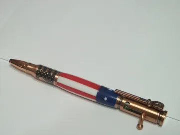 Salute America bolt-action pen finished in antique copper with a flag clip