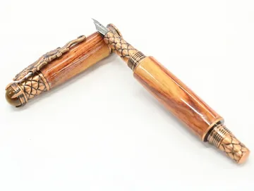 Dragon fountain pen in zebra wood with antique copper dragon clip