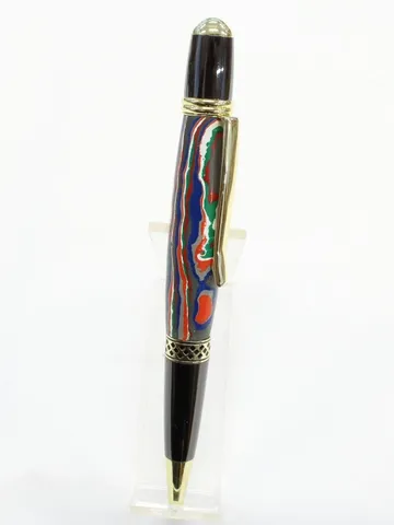 Mesa style pen with 24kt gold trim and a fordite barrel