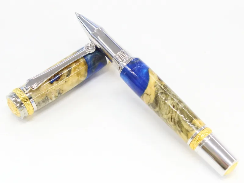 Majestic rollerball in buckeye burl and silver blue resin hybrid with rhodium and 22kt gold trim