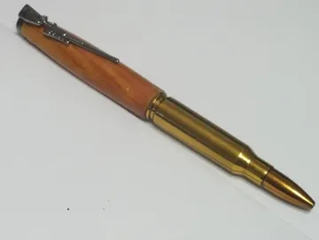 .308 rifle cartridge pen in cedar with a gun metal clip and cap