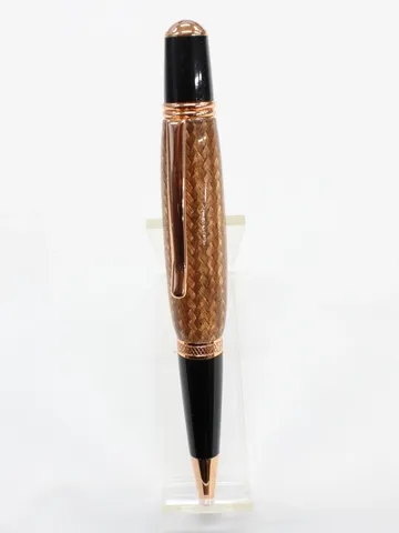 Wall St II style pen with copper trim and a braided copper barrel in clear resin