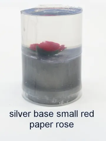 Bottle stopper blank with a red paper rose over a silver base