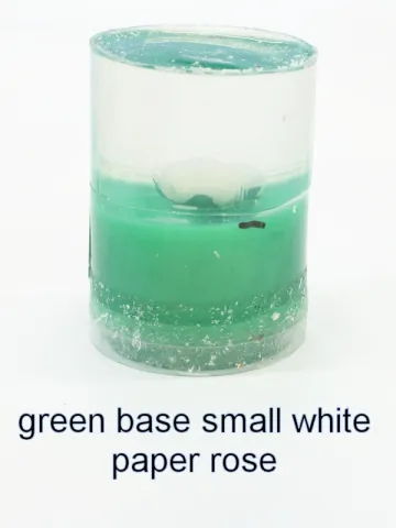 Bottle stopper blank with a white paper rose over a green base