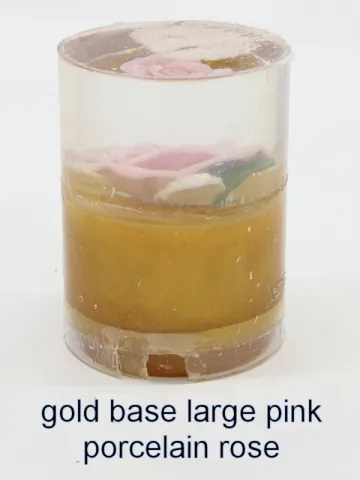 Bottle stopper blank with a large pink porcelain rose over a gold base