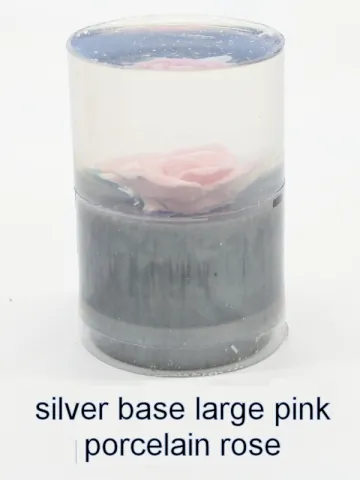 Bottle stopper blank with a large pink porcelain rose over a silver base