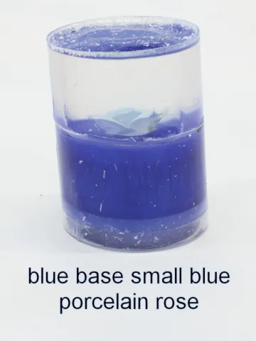 Bottle stopper blank with a smaller blue porcelain rose over a blue base