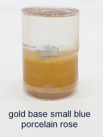 Bottle stopper blank with a smaller blue porcelain rose over a gold base