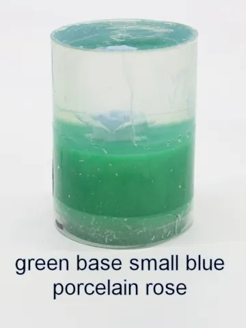 Bottle stopper blank with a smaller blue porcelain rose over a green base