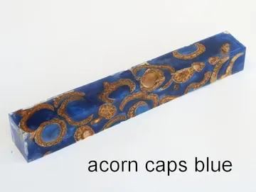 Pen blank of acorn caps suspended in blue resin