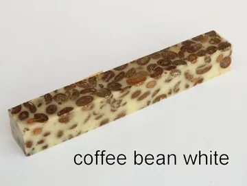 Pen blank of coffee beans suspended in white resin