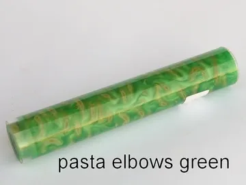 Pen blank of elbow pasta suspended in green resin