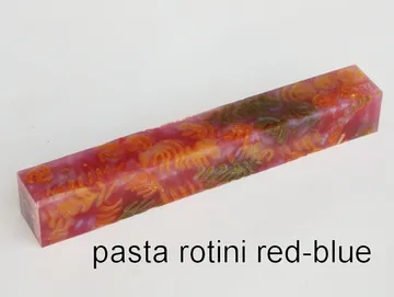 Pen blank of tri-colored rotini pasta suspended in red and blue resin