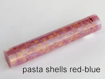 Pen blank of mini shell pasta suspended in red and blue resin