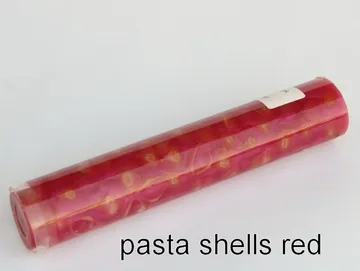 Pen blank of mini shell pasta suspended in red resin