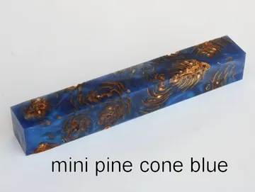 Pen blank of mini pine cones suspended in blue resin