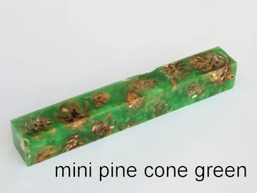 Pen blank of mini pine cones suspended in green resin
